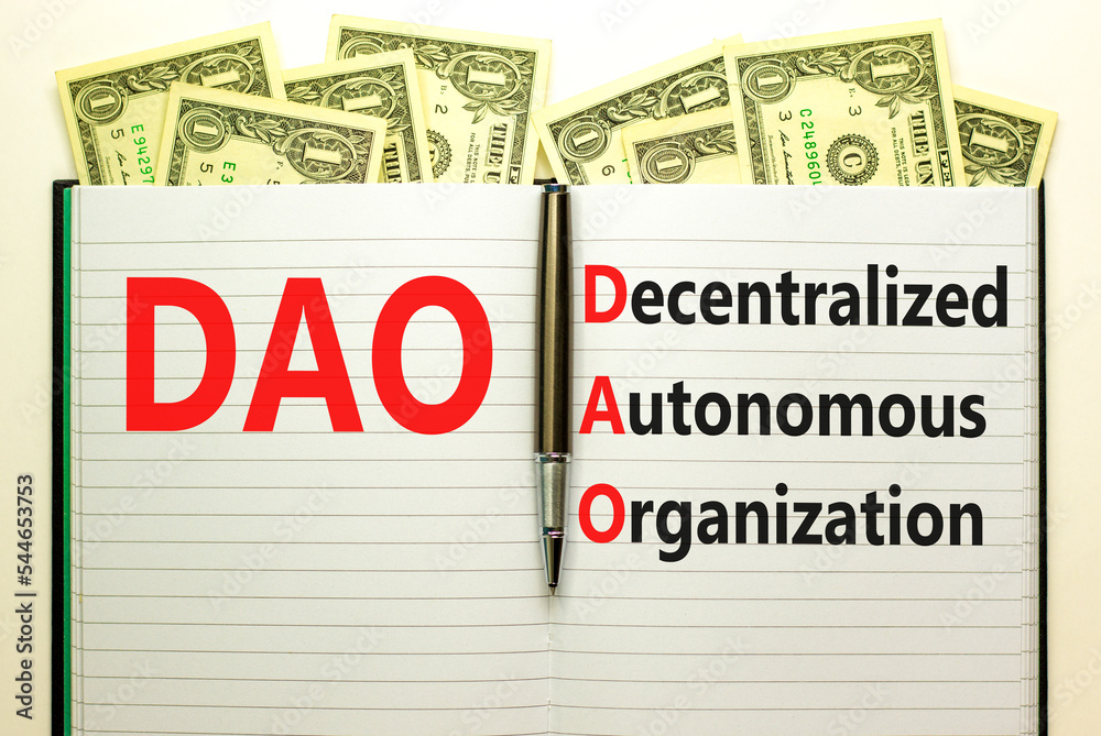 DAO decentralized autonomous organization symbol. Concept words DAO decentralized autonomous organization on white note on a beautiful white background. Business and DAO concept. Copy space. DAO decentralized autonomous organization symbol. Concept words DAO decentralized autonomous organization on white note on a beautiful white background. Business and DAO concept. Copy space.