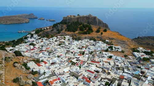 Lindos is a town on the Greek island of Rhodes. It’s known for its clifftop acropolis, which features monumental 4th-century gates and reliefs from about 280 B.C. photo