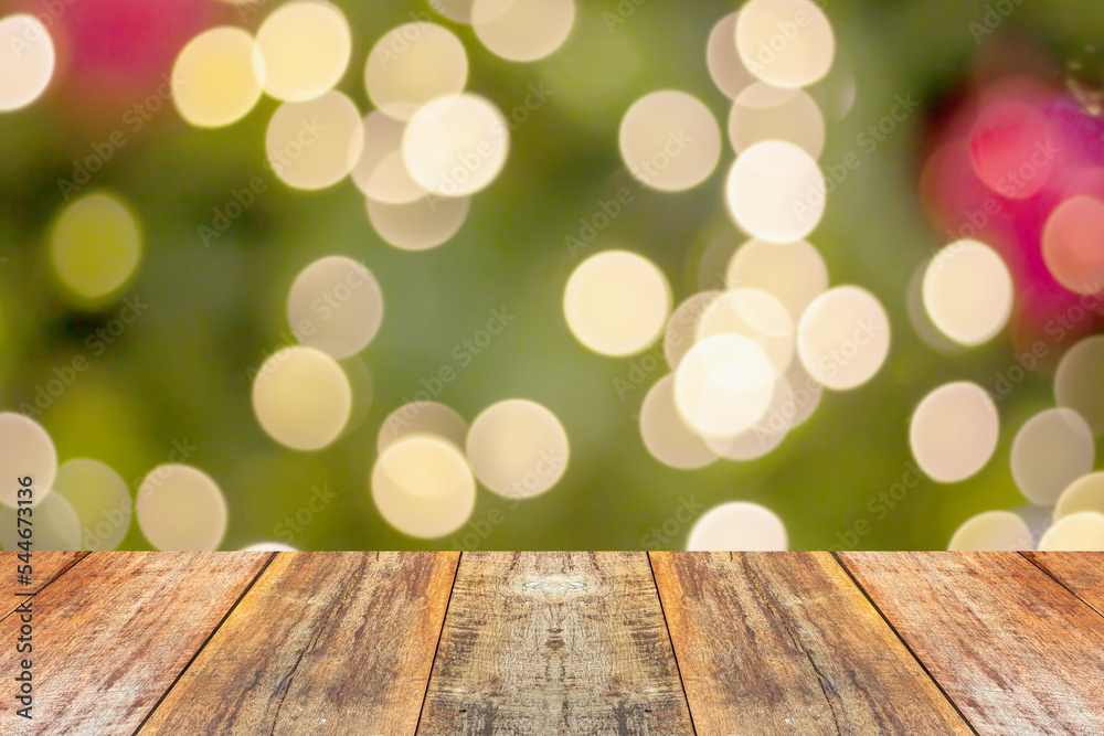 Empty wood table top with blur Christmas tree with bokeh light background Empty wood table top with blur Christmas tree with bokeh light background