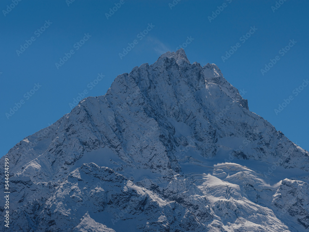 Obraz premium journey by Irkis valley, Arkhyz, Karachay-Cherkessia, North Caucasus. snowy mountain valley with blue sky and clouds and beautiful forest near river Psysh, Caucasus nature reserve. Alpine landscape.