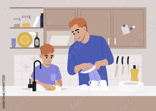 Cute redhead family washing dishes in the kitchen, domestic chores