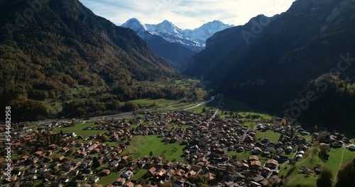 Wilderswil drone shot with Eiger, Mönch, Jungfrau and train passing - Aerial 4K