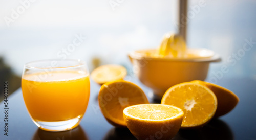 Drink. Oranges and manual citrus juicer
