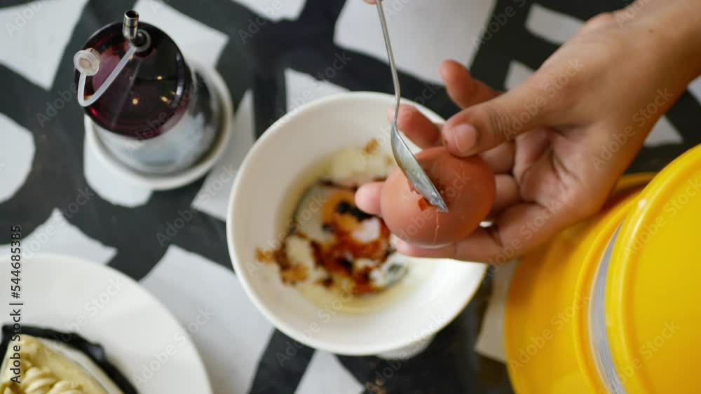 top view of crack a egg with a spoon top view of crack a egg with a spoon