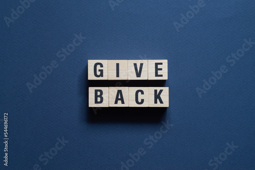 Give Back - word concept on cubes