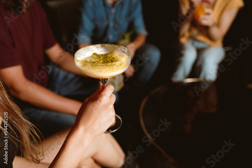 girl holding a cocktail