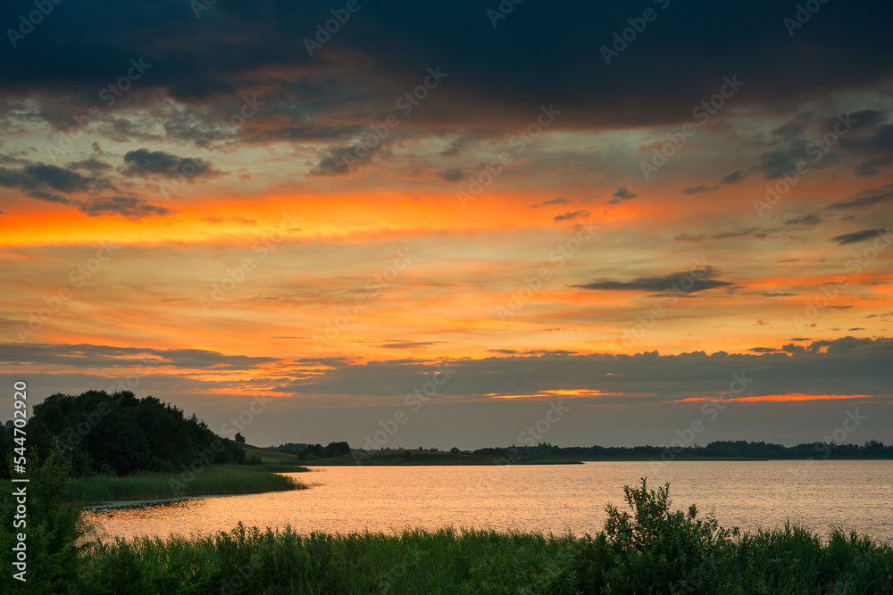 Serene landscape with a lake lake in the evening