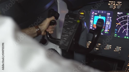 Closeup of professional pilot controlling passenger airliner in dangerous turbulence zone