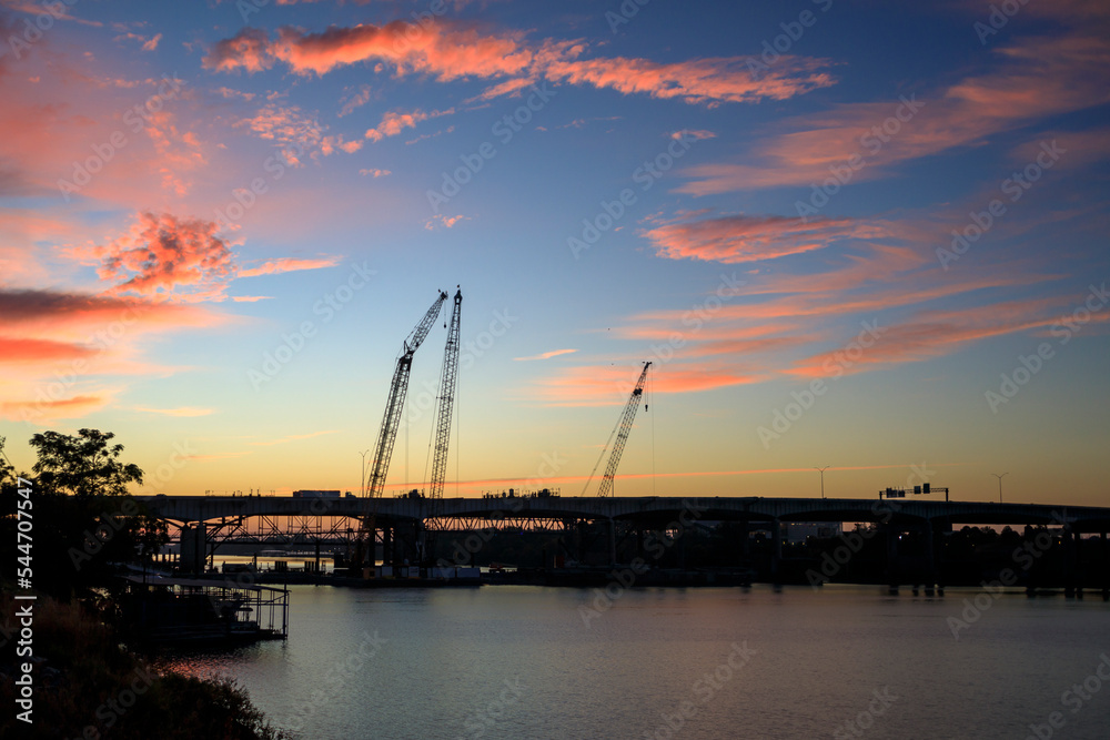 Construction cranes working on the Arkansas River Bridge