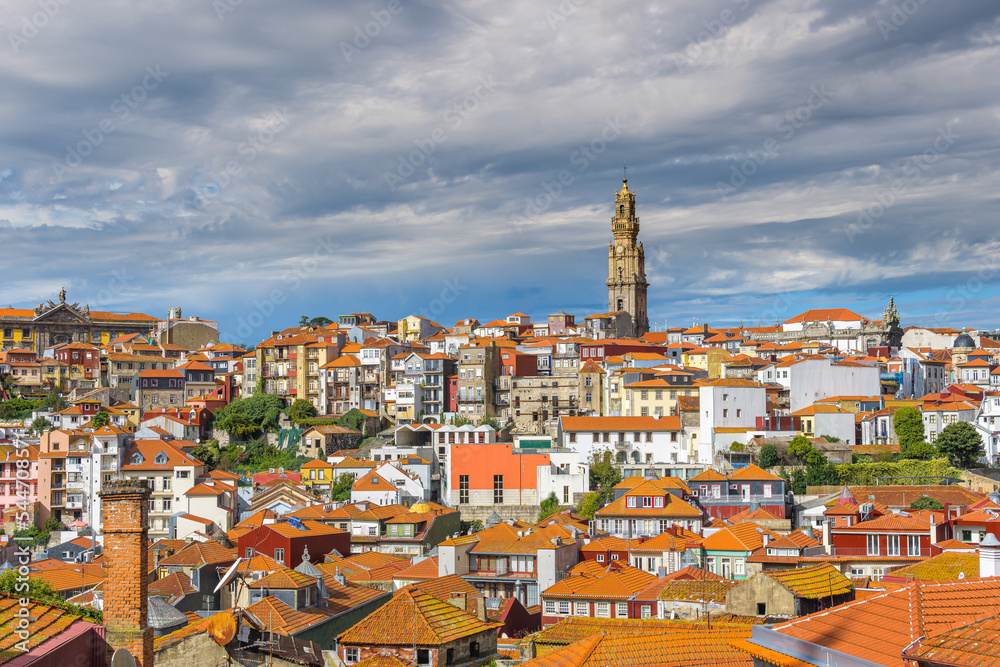 Panorama of Porto town, Portugal. Travel places and landmarks. Picturesque buildings with windows and orange roofs