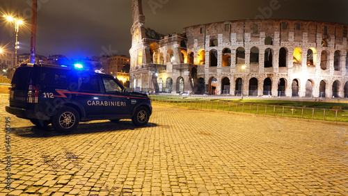 The car of the local police (carabinieri) stands in the center of Rome near the Colosseum. Night Rome Italy