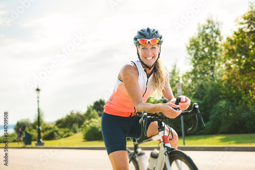 professional female cyclist in protective gear outdoors on a daytime