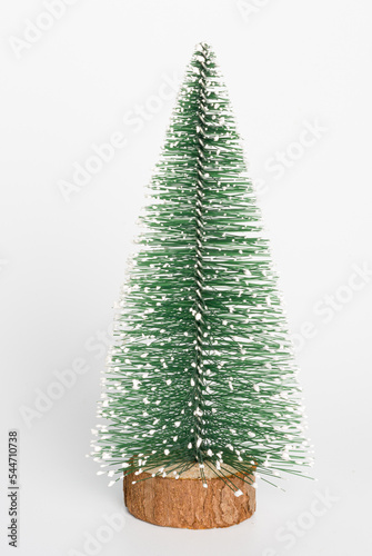 decorative Christmas tree, figurine on a white background, close-up