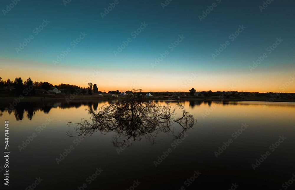 Obraz premium sunset over the river