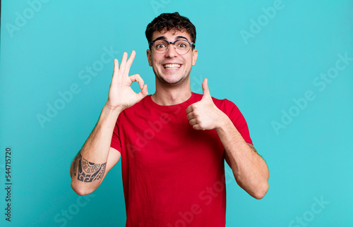 feeling happy, amazed, satisfied and surprised, showing okay and thumbs up gestures, smiling