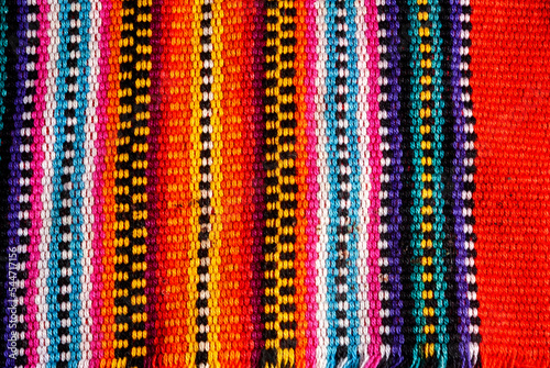 Detail of handmade textile by Mayan Indians in Guatemala, colorful cotton, ancestral cosmology.