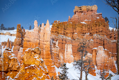 bryce canyon national park in winter, unique rock formations in utah covered in snow, orange rocks in snow, cold winter in the usa
