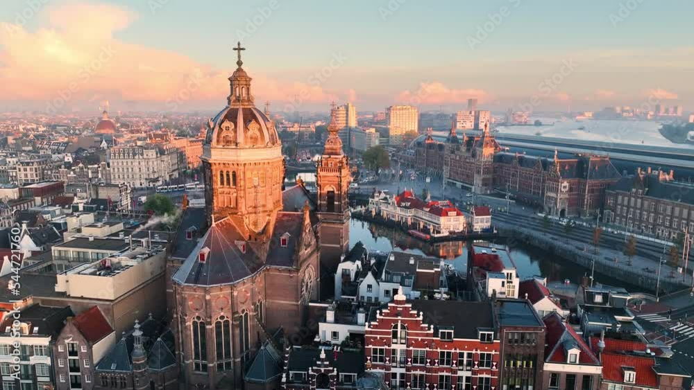 Aerial view of famous places Amsterdam, Netherlands. View of canal and old centre district. railway station Amsterdam Centraal
