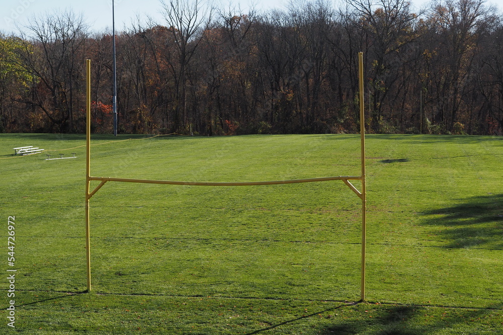 There isn't a game today, however we see the yellow goal post and the field. There isn't a game today, however we see the yellow goal post and the field.