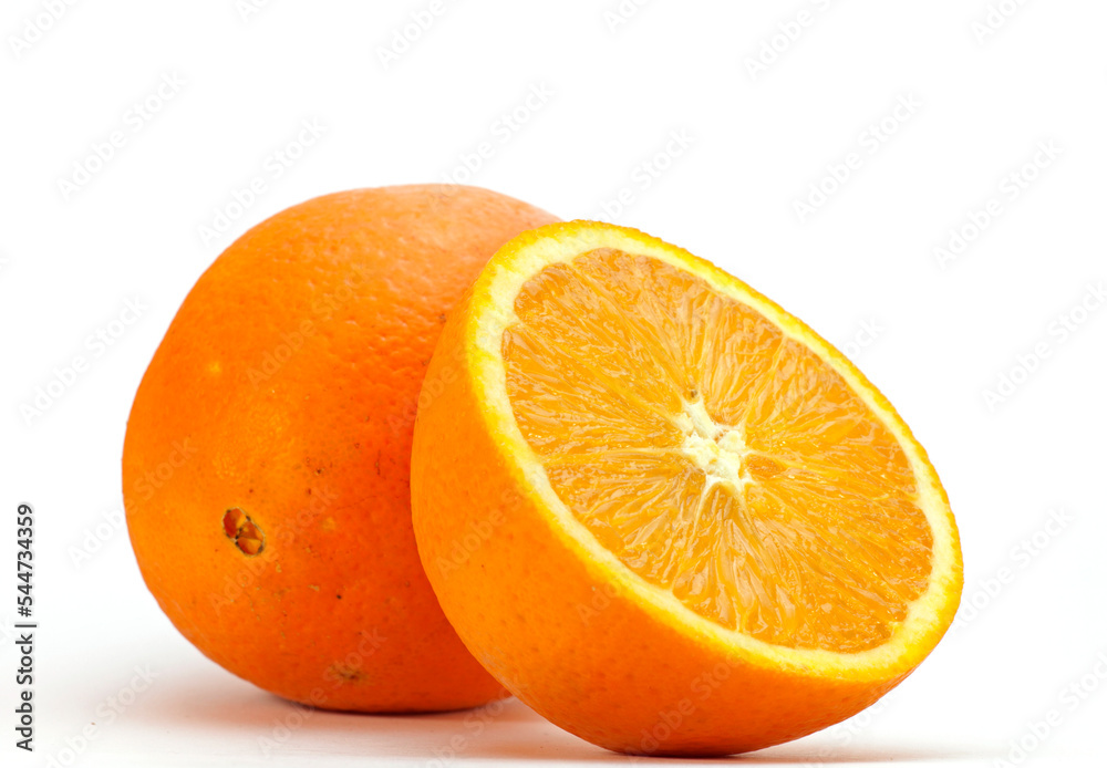Fresch orange and an orange cut through the middle photographed with a white background
Fresch orange and an orange cut through the middle photographed with a white background