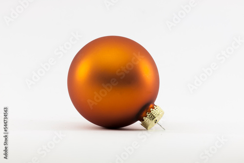 Orange christmas nall photographed with a white background photo