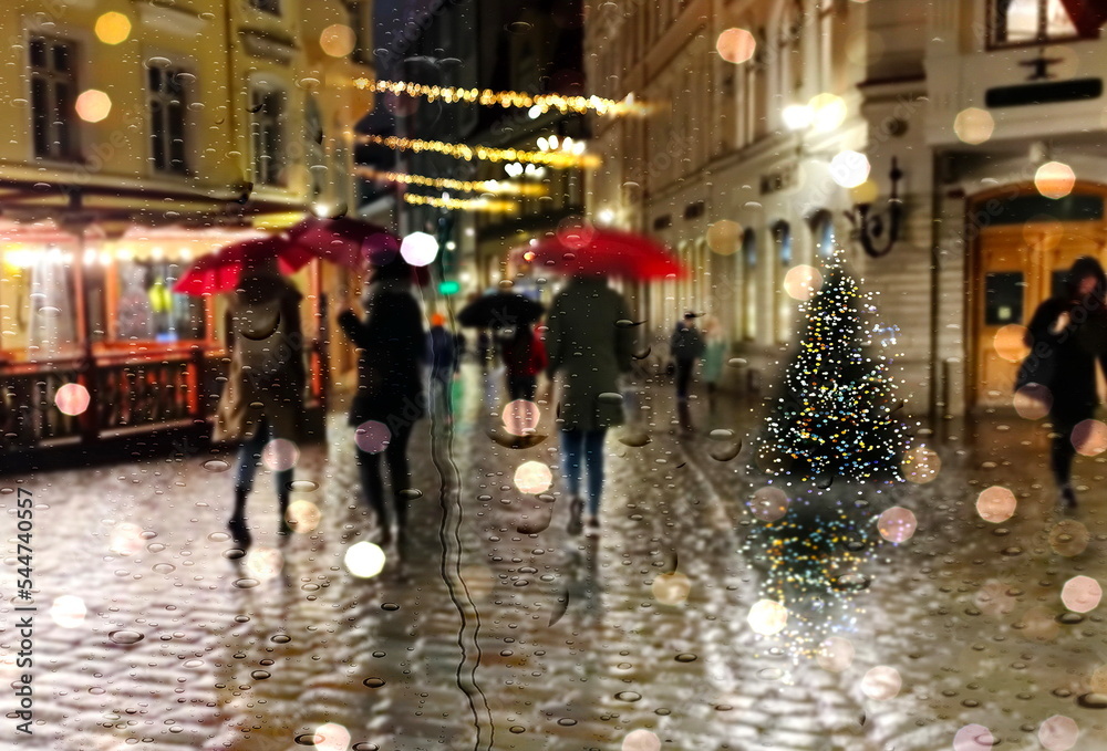 Rainy Christmas  evening city street light people with umbrellas walk medieval Tallinn old town rain drops on shop windows glass Autumn season weather forecast