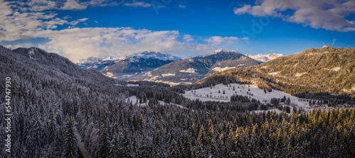 A Mountain valley near Techendorf and lake Weissensee in Carinthia or Karnten, Austria. Panoramic aerial drone picture. January 2022 photo