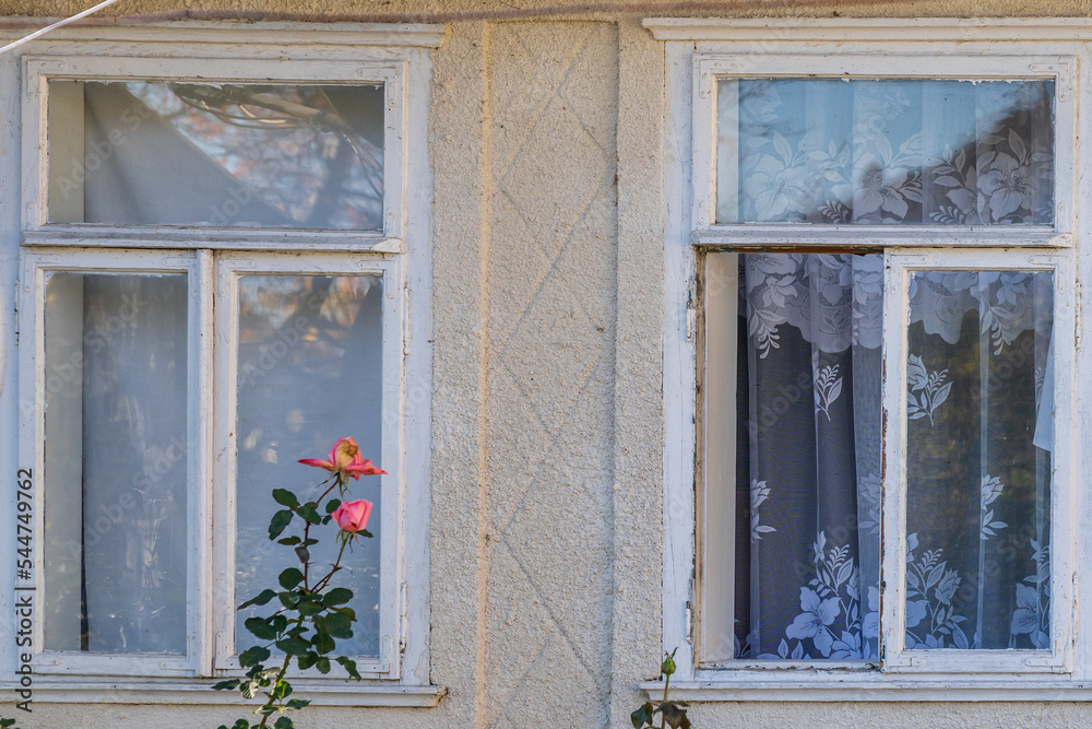 A broken window in an old village house. Background with selective focus and copy space