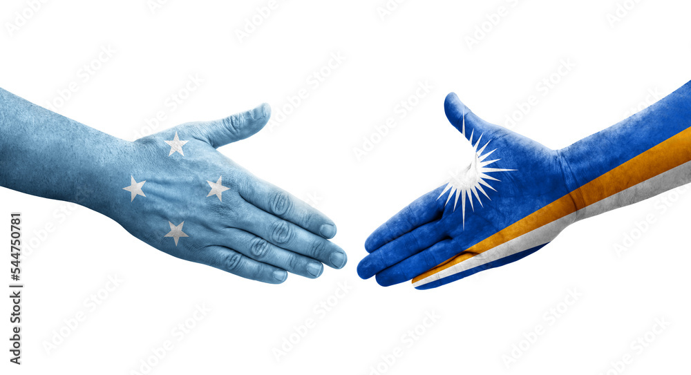 Handshake between Micronesia and Marshall Islands flags painted on hands, isolated transparent image. Handshake between Micronesia and Marshall Islands flags painted on hands, isolated transparent image.
