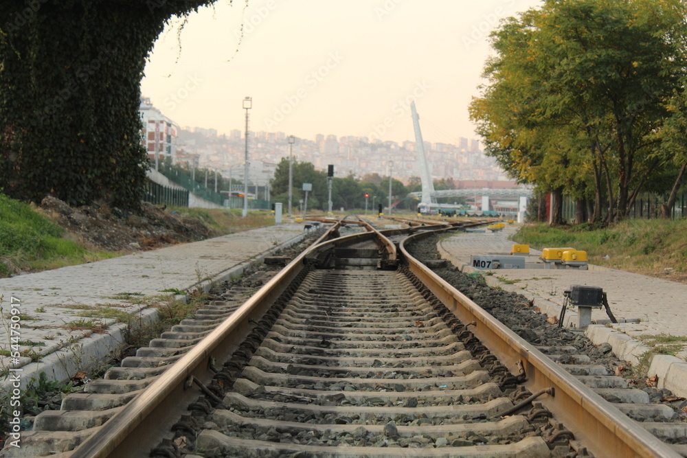 Train tracks under a bridge without trains Train tracks under a bridge without trains