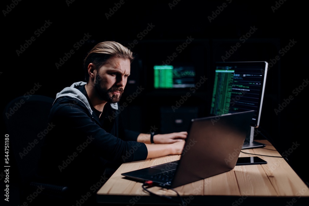 Programmer hacking on computers Programmer hacking on computers