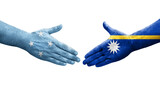 Handshake between Micronesia and Nauru flags painted on hands, isolated transparent image.