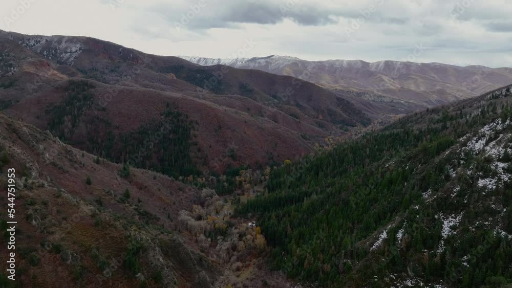 Aerial mountain valley forest early winter snow. Beautiful late autumn early winter Wasatch Mountains. Valley and alpine landscape. Mount Nebo Scenic Byway, Utah. Aspen, maple and oak trees colorful. Aerial mountain valley forest early winter snow. Beautiful late autumn early winter Wasatch Mountains. Valley and alpine landscape. Mount Nebo Scenic Byway, Utah. Aspen, maple and oak trees colorful.
