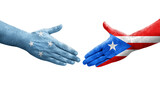Handshake between Micronesia and Puerto Rico flags painted on hands, isolated transparent image.