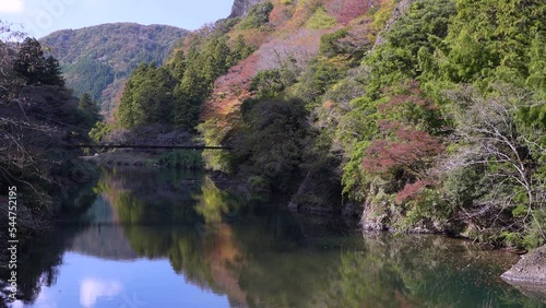 Shimane,Japan - November 8, 2022: A man crossing Furou bridge over Kando river at Tachikue gorge 
 photo