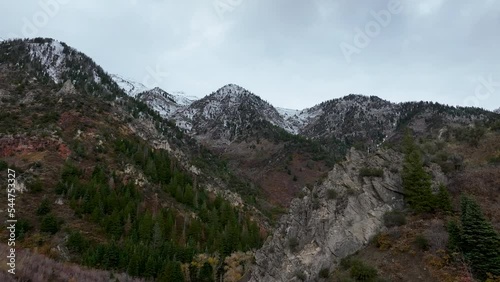 Aerial steep mountain early winter snow. Beautiful late autumn early winter Wasatch Mountains. Valley and alpine landscape. Mount Nebo Scenic Byway, Utah. Aspen, maple and oak trees colorful. photo