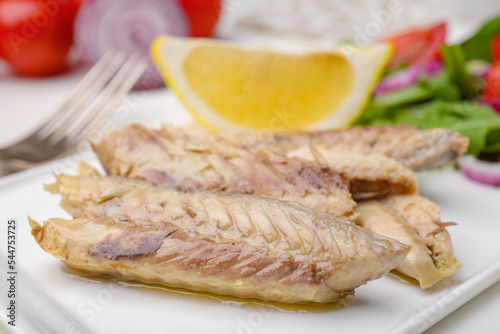 Delicious canned mackerel fillets served on table, closeup