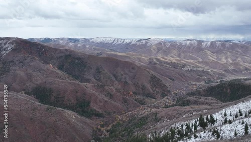 Aerial mountain canyon valley early winter. Beautiful late autumn early winter Wasatch Mountains. Valley and alpine landscape. Mount Nebo Scenic Byway, Utah. Aspen, maple and oak trees colorful. photo