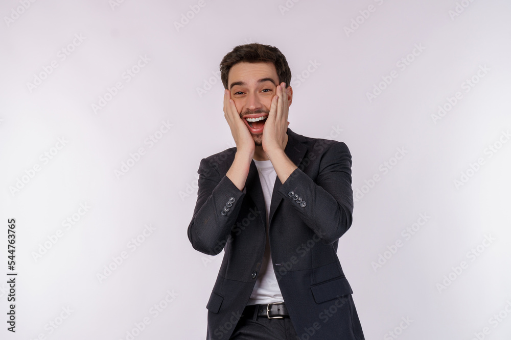 Portrait of happy young businessman standing using mobile cell phone and holding credit bank card isolated on white color background studio Portrait of happy young businessman standing using mobile cell phone and holding credit bank card isolated on white color background studio
