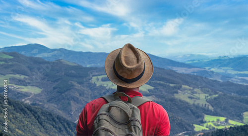 Traveler Man relaxing with serene view mountains landscape- Travel Lifestyle concept