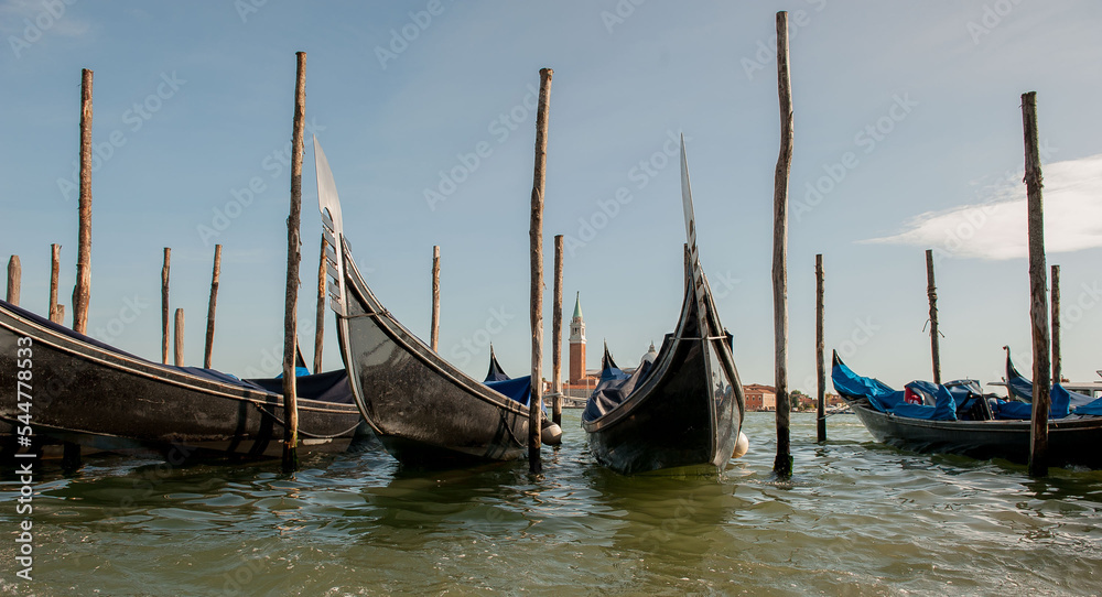 Gondola at jetty with background Giudecca in Venice