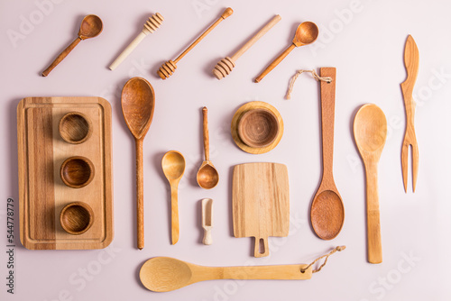 top view of a set of different wooden and bamboo kitchen utensils. flat layout. eco-friendly cutlery. zero waste.