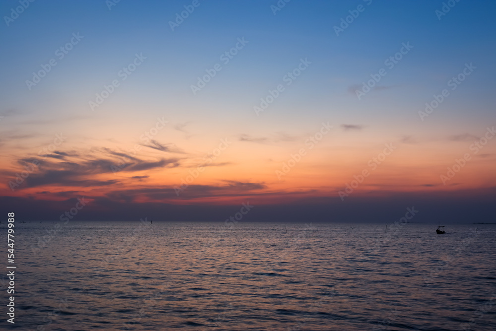 Calm sea with sunset sky and sun through clouds above. sky ocean meditation calm sea horizon over water