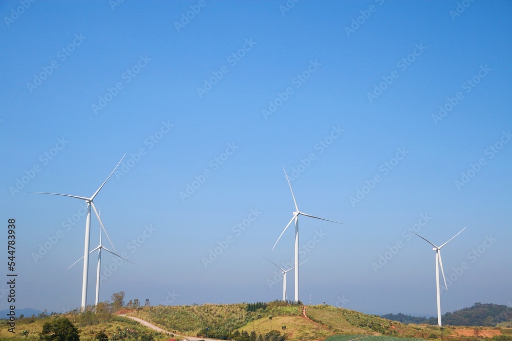 Landscape with hills and wind turbines and blue sky backgound. Landscape with hills and wind turbines and blue sky backgound.