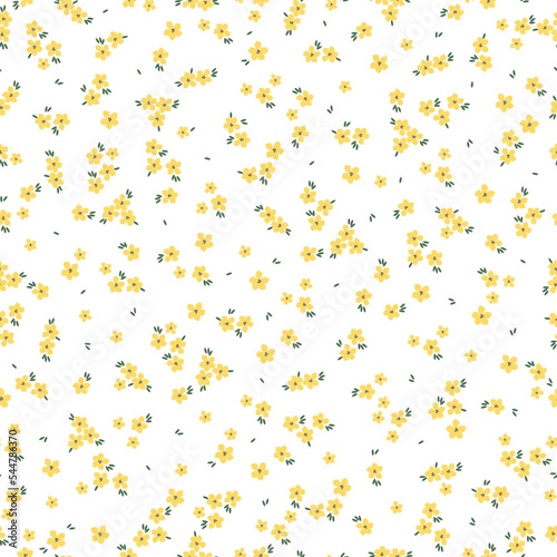Cute floral pattern. Seamless vector texture. An elegant template for fashionable prints. Print with small yellow flowers, green leaves. white background.