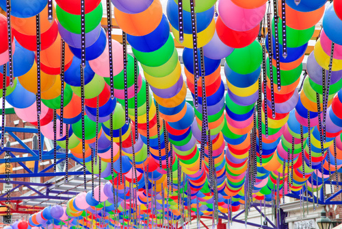 Patterns of colorful balloons, colored gel balls, and new year decorations. photo
