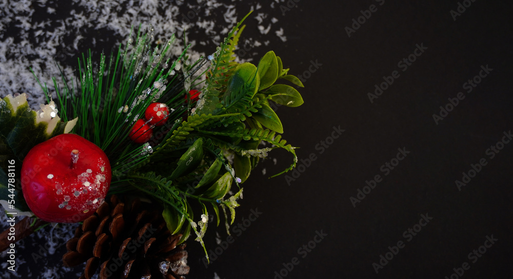 beautiful black christmas background for postcards, flyers, banners. Christmas tree branch and Christmas balls and toys