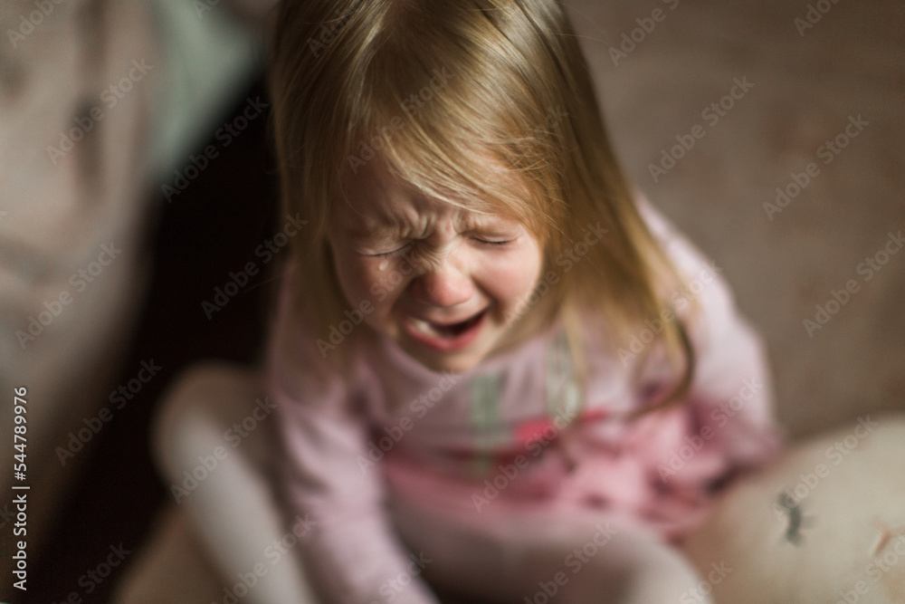 a little girl patches in her children's room. bitter tears