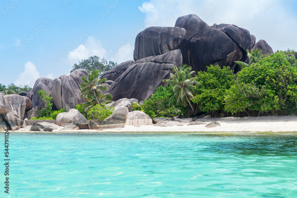 Tropical Seychelles beach with palm trees
