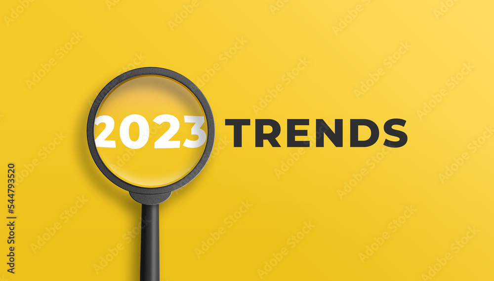 Magnifying glass magnifies 2023 trends on yellow background. Focusing on the year 2023 for technology trends update concept. 3D illustration. - obrazy, fototapety, plakaty 